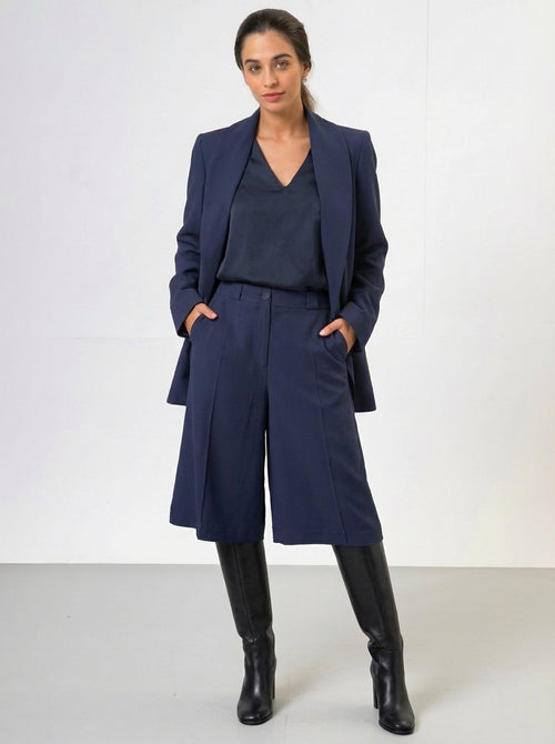 Woman wearing a culotte suit with a blazer for work